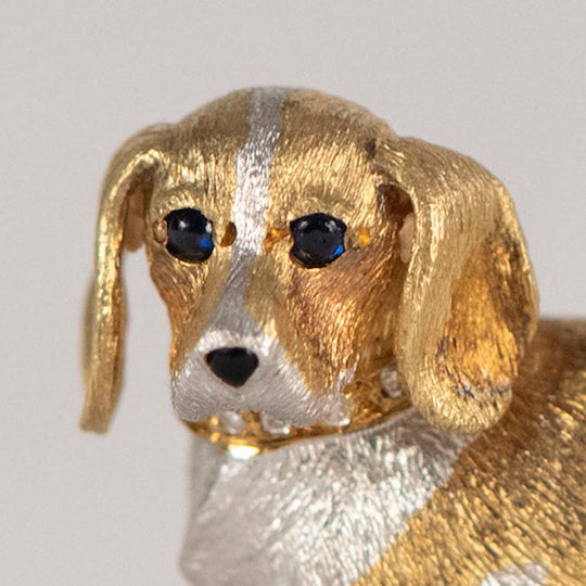 18 karat yellow and white gold, blue sapphire and diamond dog pin
