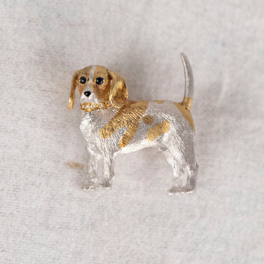 18 karat yellow and white gold, blue sapphire and diamond dog pin