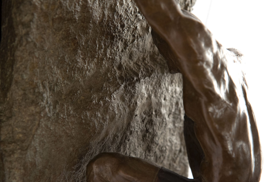 A Bronze Wall Sculpture of a Rock Climber by Jim Rennert